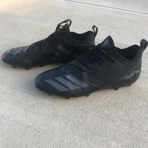 black adimoji cleats
